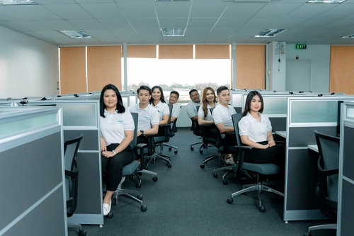 Team of professionals in an office setting focused on social media marketing in the Philippines.