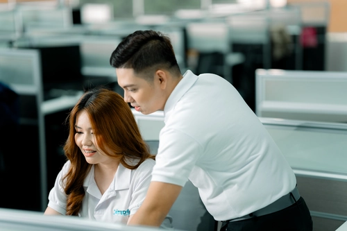 A virtual front desk receptionist providing support in a busy office environment.